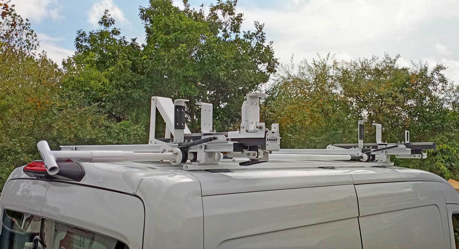 Ranger Design MAX Rack drop-down ladder rack mounted on the roof of a white commercial van